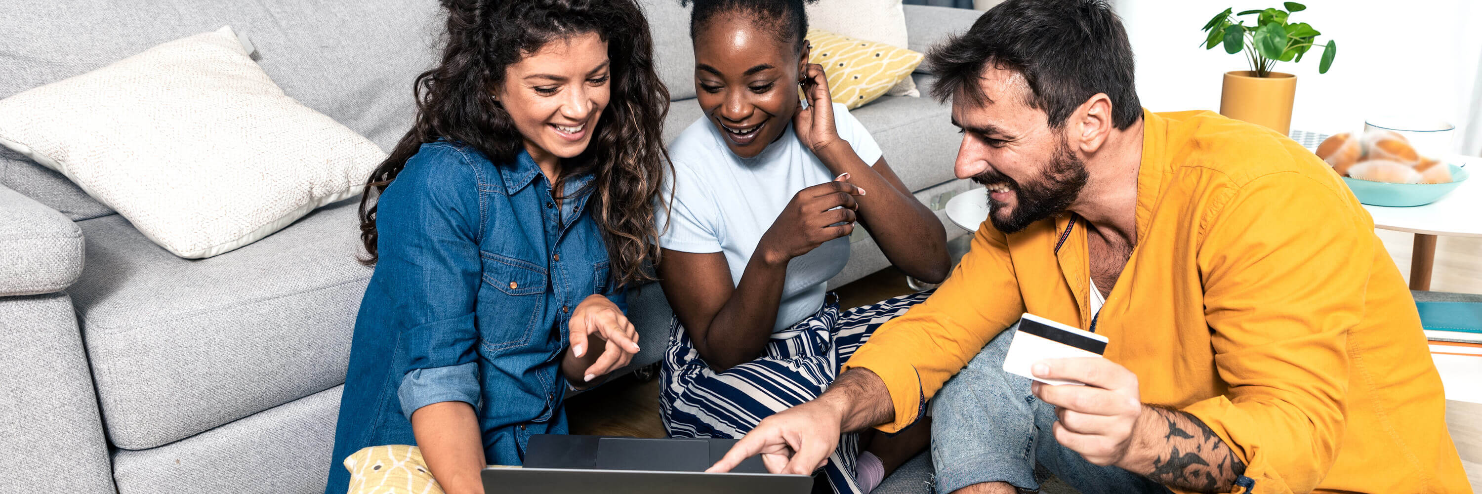 Group of friends ordering food online with laptop